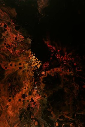 An abstract field of black, red, orange, and molten-looking forms.
